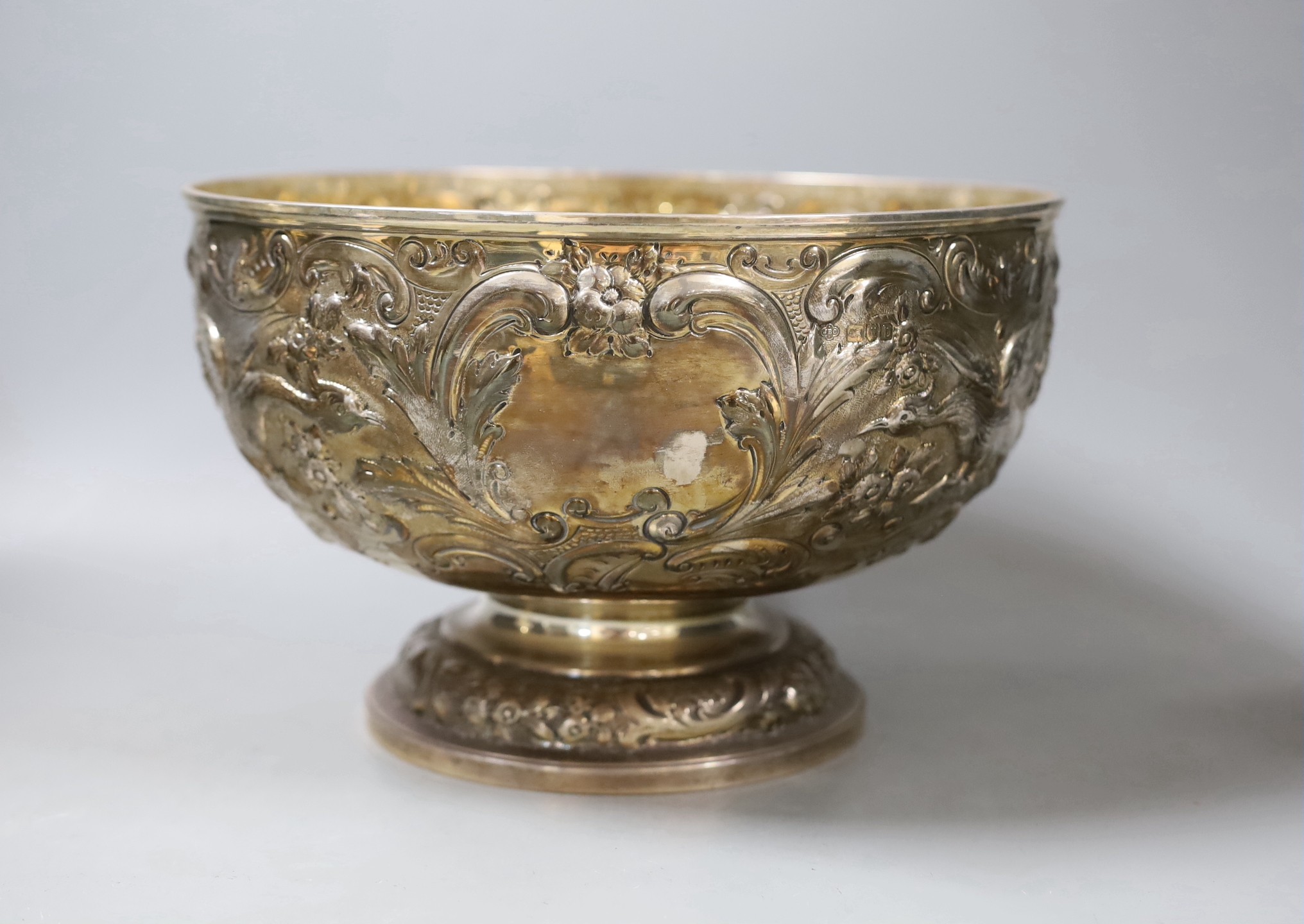 A late Victorian embossed silver rose bowl, decorated with birds amid scrolls, Carrington & Co, London, 1897, diameter, 26.5cm